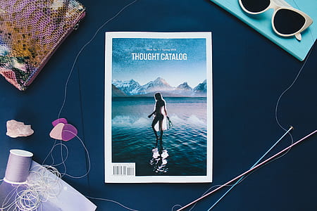 Thought Catalog book beside sunglasses thumbnail