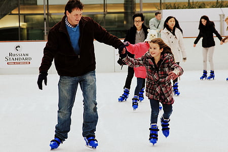 man holding girl white wearing inline skates thumbnail