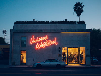 red neon signage on concrete wall thumbnail