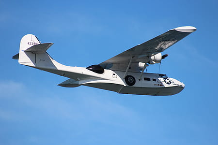 white airplane in flight thumbnail