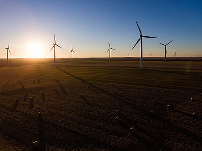 white windmill under blue sky thumbnail