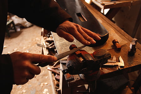 person sharpening throwing knife thumbnail