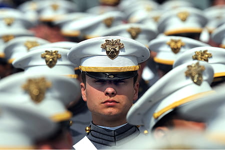 selective focus photography of man wearing military cap thumbnail