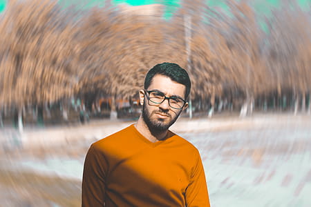 Man in Orange Crew-neck Top thumbnail