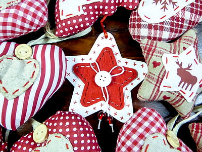 assorted-color star and heart pillows on brown wooden surface thumbnail