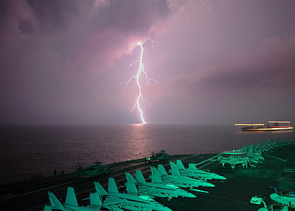 photo of lightning near aircraft carrier thumbnail