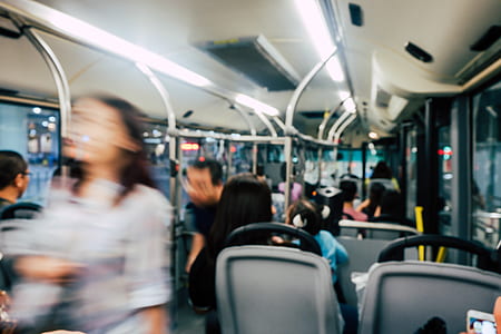 woman walking inside bus thumbnail