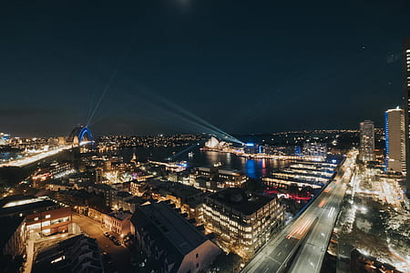 aerial photo of black concrete buildings during night time thumbnail