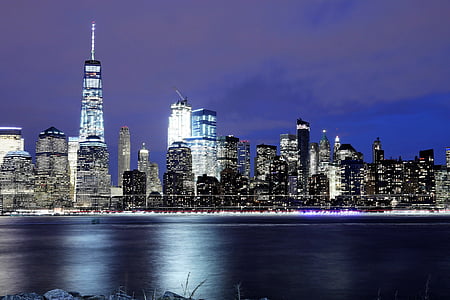 low light photography of city skyline during nighttime thumbnail