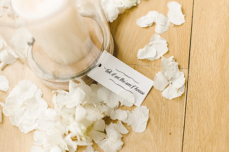White Candle Inside Clear Glass Container thumbnail