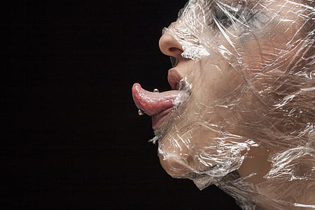 clear plastic pack covered on human face thumbnail