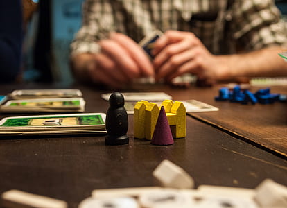 monopoly pieces on table thumbnail