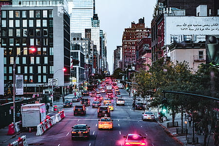 road with passes vehicles between buildings thumbnail
