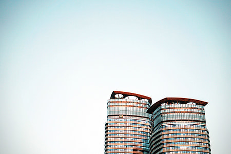 two brown concrete buildings thumbnail