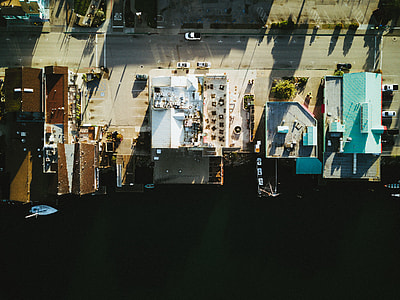 aerial photo of buildings near road with cars thumbnail