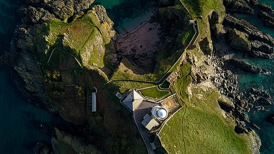 aerial photography of island with building at daytime thumbnail