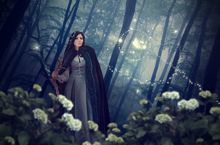 woman wearing black robe on forest thumbnail