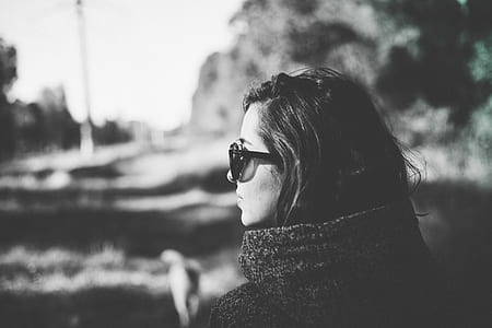 grayscale photography of woman wearing sunglasses thumbnail