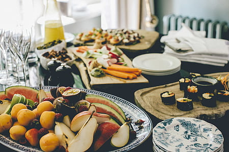 fruits on tray beside sushi and vegetables thumbnail