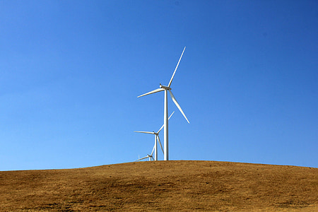 white windmills on mountain during daytime thumbnail