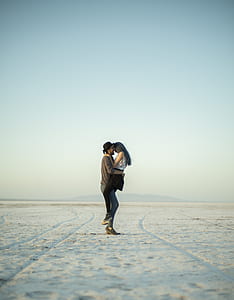 man carrying woman on dessert thumbnail