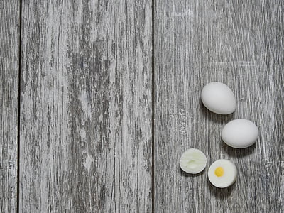 hard-boiled egg on gray wooden surface thumbnail