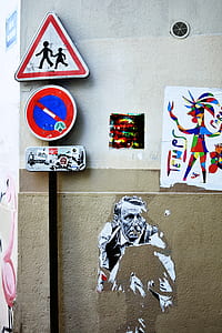road signs on wall and mural thumbnail