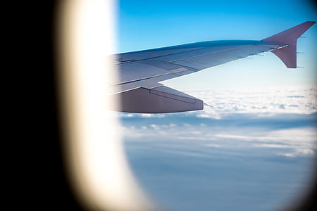 photo of airplane's right wing in the sky thumbnail