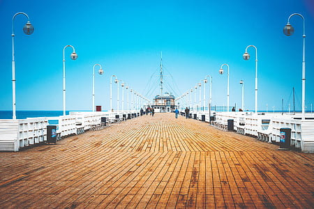 brown paved dockyard during daytime thumbnail