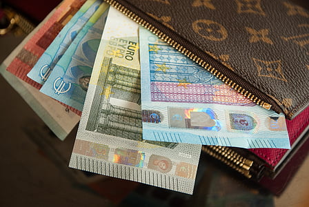 closeup photo of assorted-denomination banknotes thumbnail