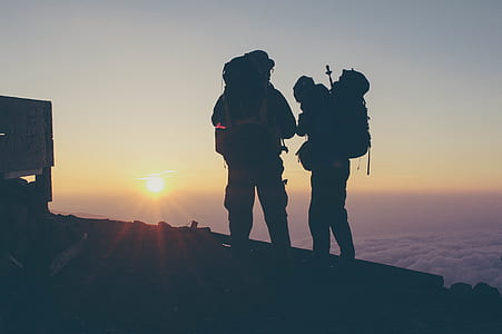 silhouette of men two men at the hill thumbnail