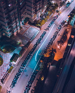 aerial view of motorcycle parking lot during nighttime thumbnail