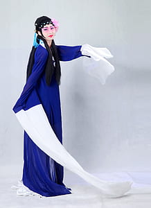 woman wearing blue long-sleeved dress thumbnail