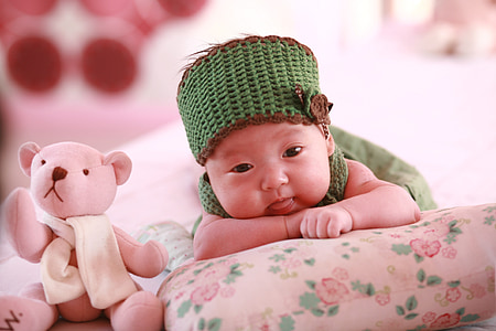 baby lying on cushion thumbnail