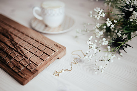 Wooden keyboard and cup of coffee thumbnail