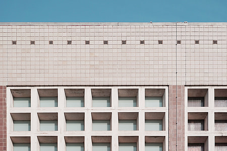 closeup photo of red and beige concrete building thumbnail