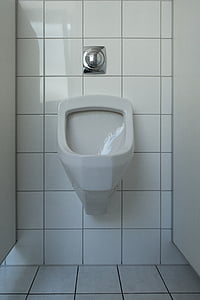 empty white ceramic urinal thumbnail