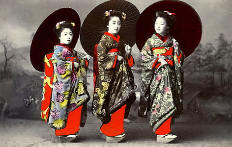 three Asian woman standing under the umbrella thumbnail