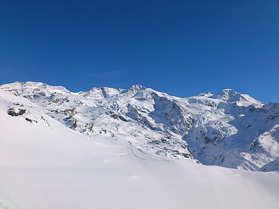 snowy mountain under blue sky thumbnail