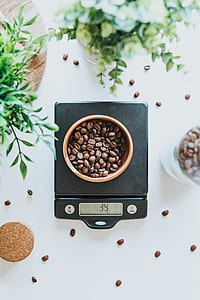bowl of coffee beans weighing thumbnail