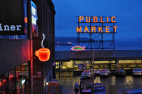 orange neon public market sign over the parking area thumbnail