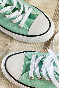 pair of green-and-white sneaker on beige textile thumbnail