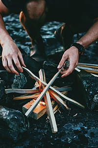 man making bonfire thumbnail