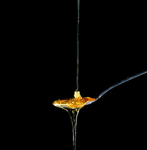 yellow syrup on spoon thumbnail