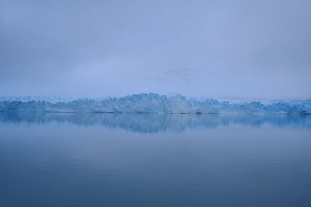 body of water with glacier at distance thumbnail