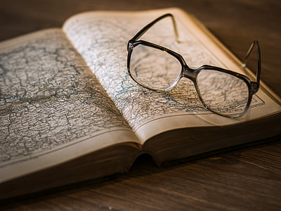 eyeglass on open book thumbnail