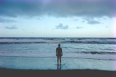 silhouette photography of man on coast thumbnail