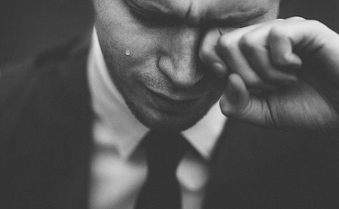 man wipe tear his eye thumbnail