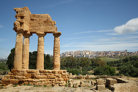 brown pillars ruin under blue skies thumbnail