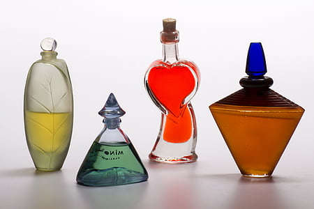 four assorted glass fragrance bottles thumbnail